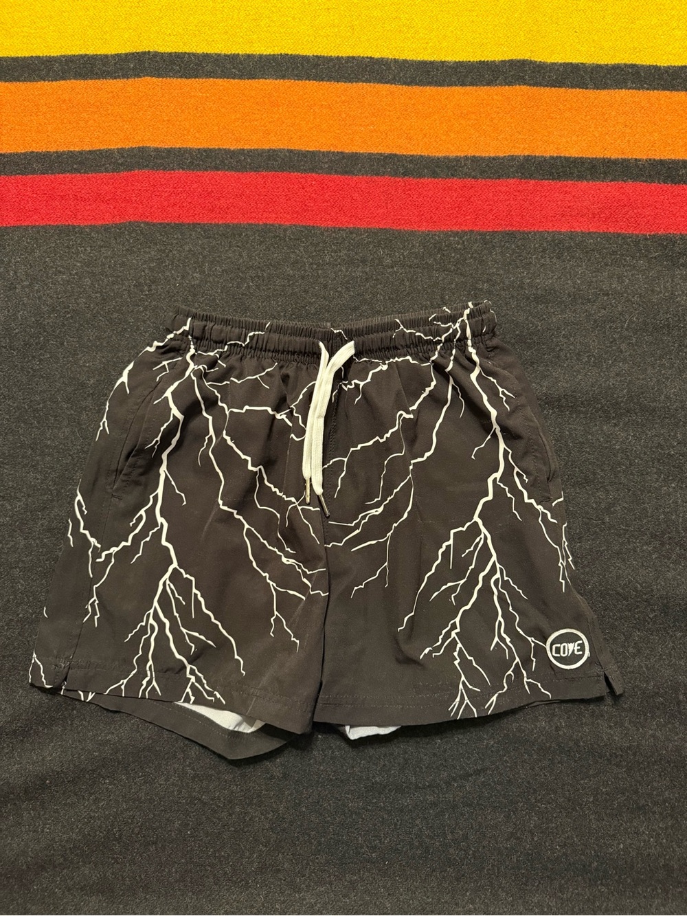 Cove Black Men's Athletic Shorts with White Lightning Graphic